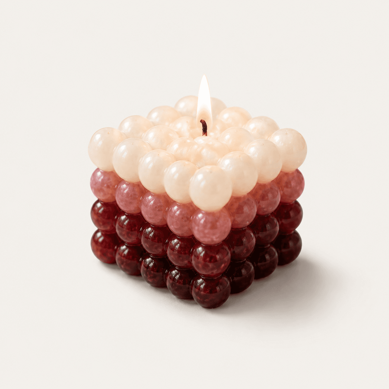 Triple-shaded vine-red bubble candle